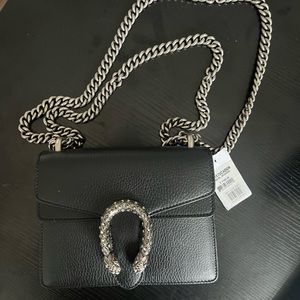 Gucci, Black DIONYSUS LEATHER MINI BAG with black Swarovski crystals.